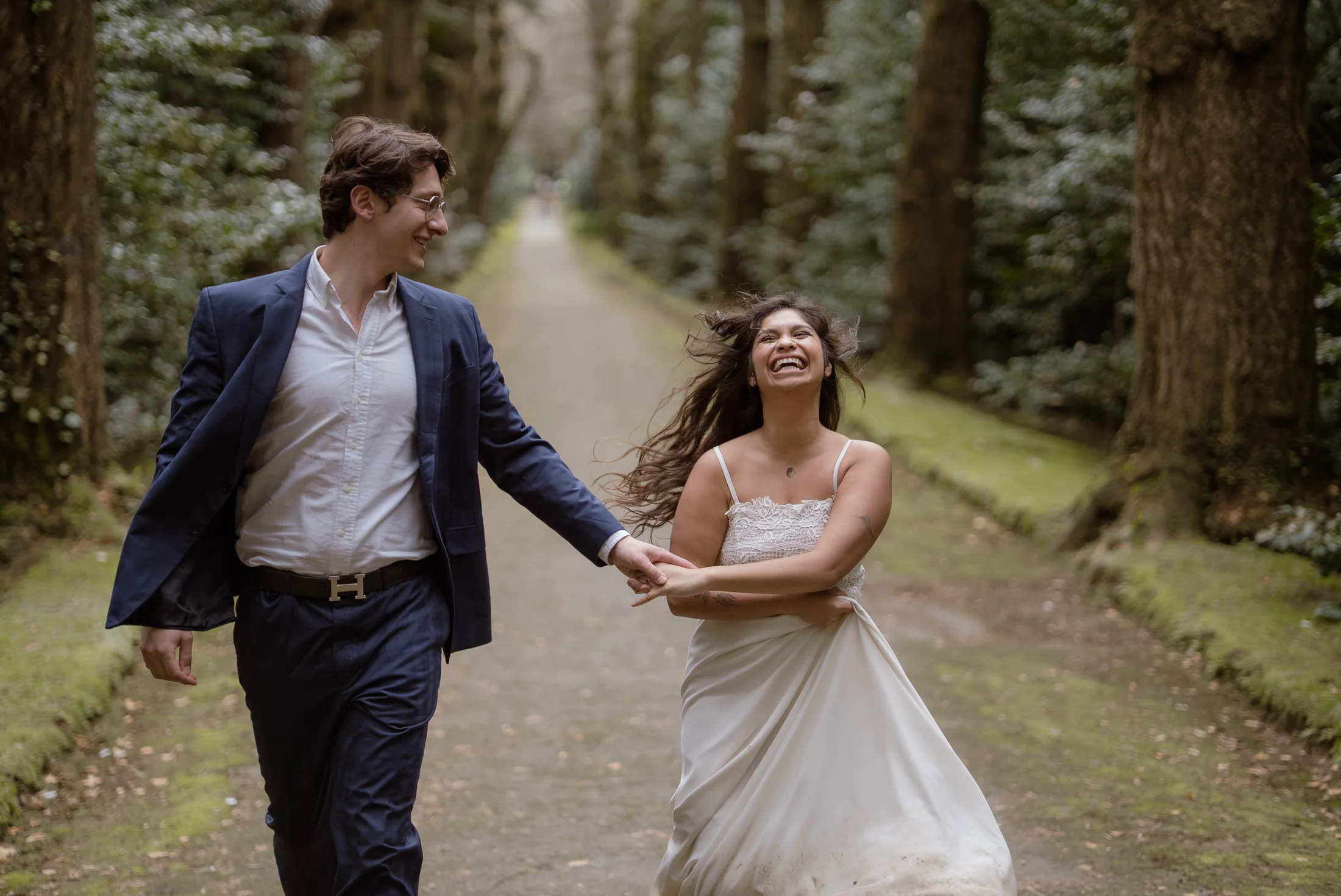 Editorial couple walking on a forest road in the Azores