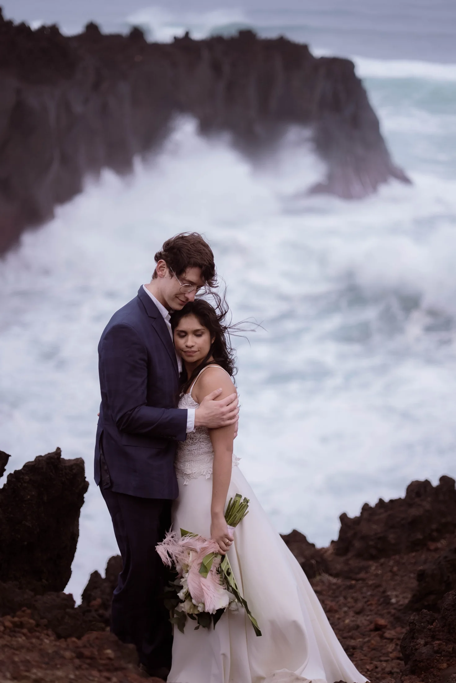 Editorial couple embracing beside the Atlantic Ocean in the Azores