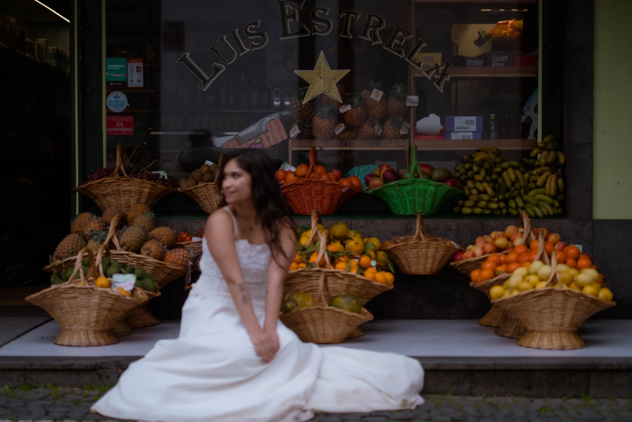 Editorial bridal portrait beside a local produce market in the Azores
