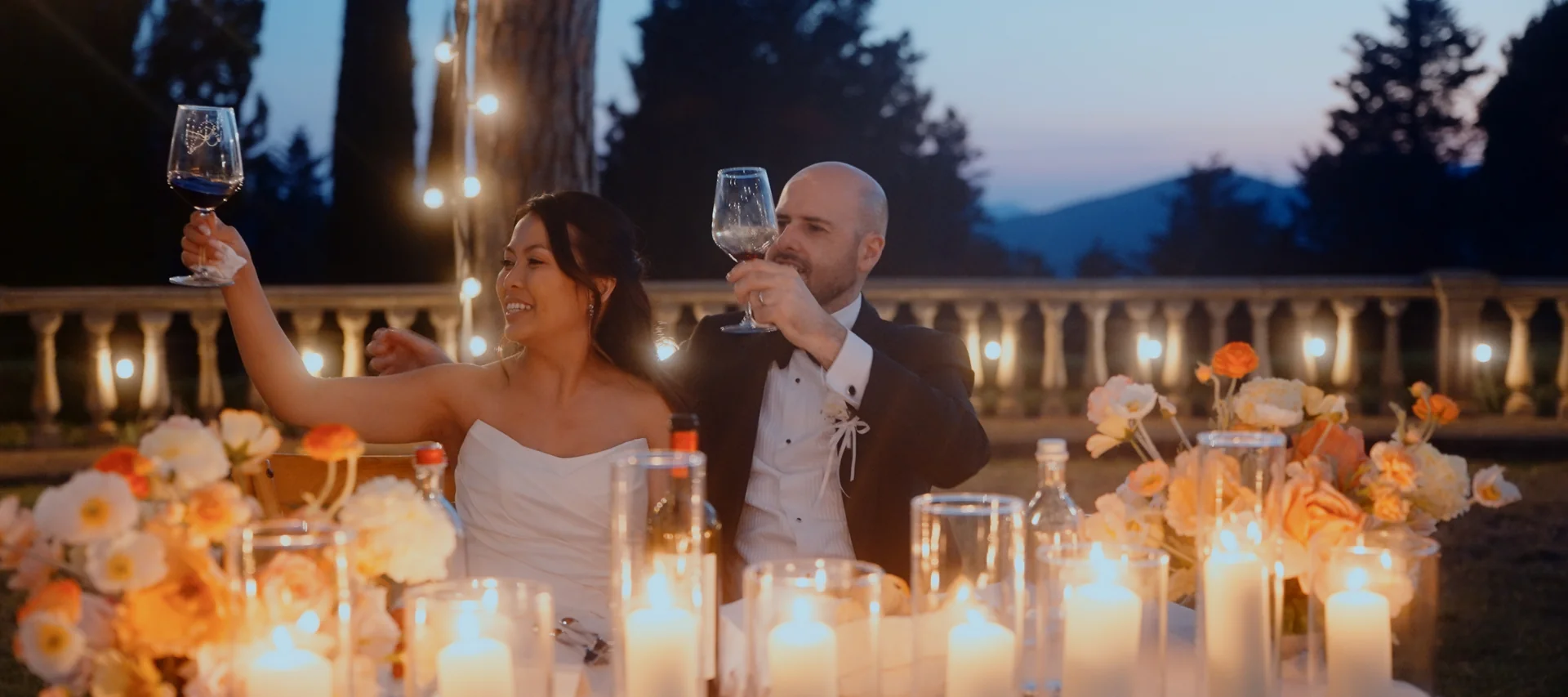 Outdoor wedding dinner beneath lights at Villa Bellaria Tuscany