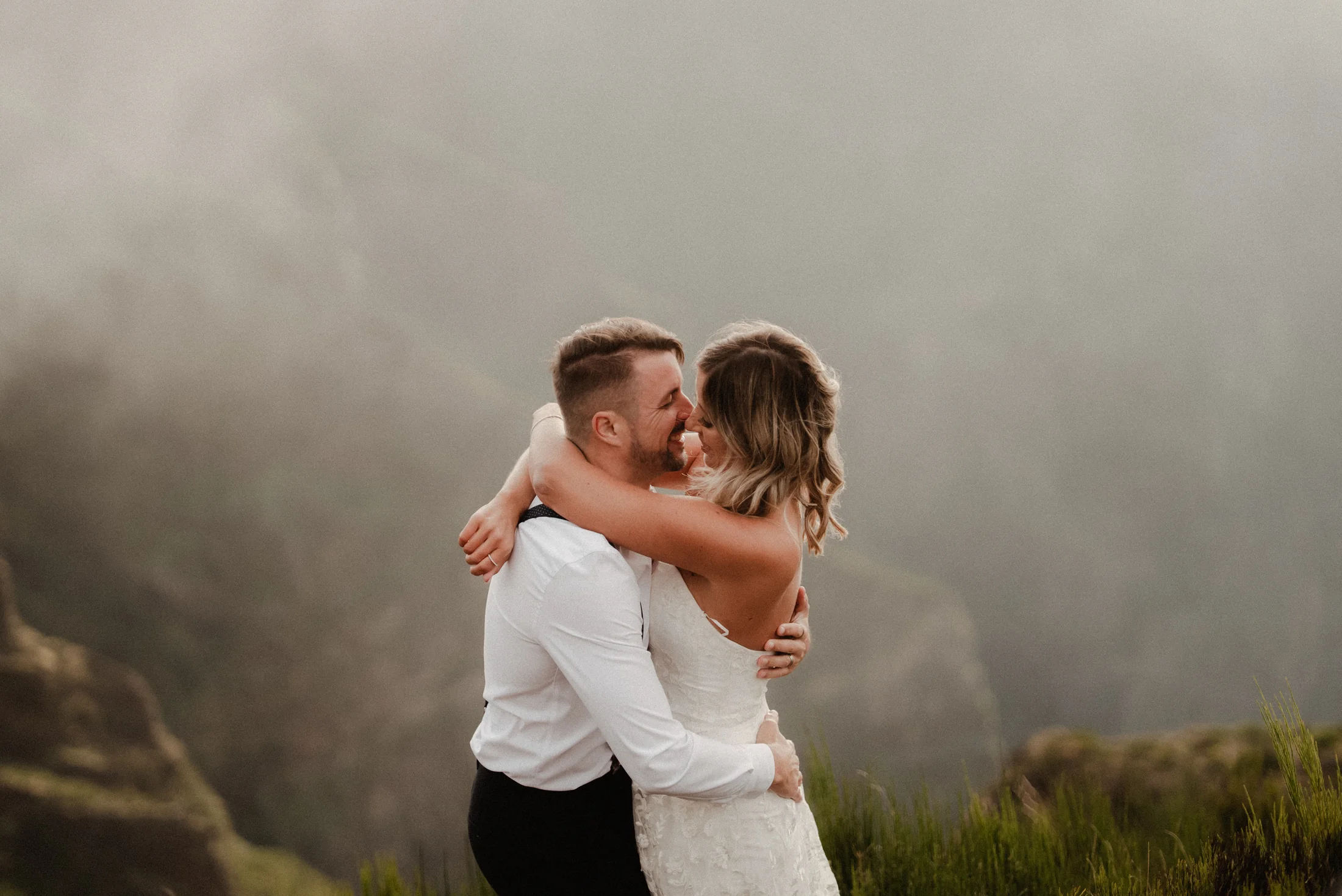 Couple surrounded by mountain mist in Madeira