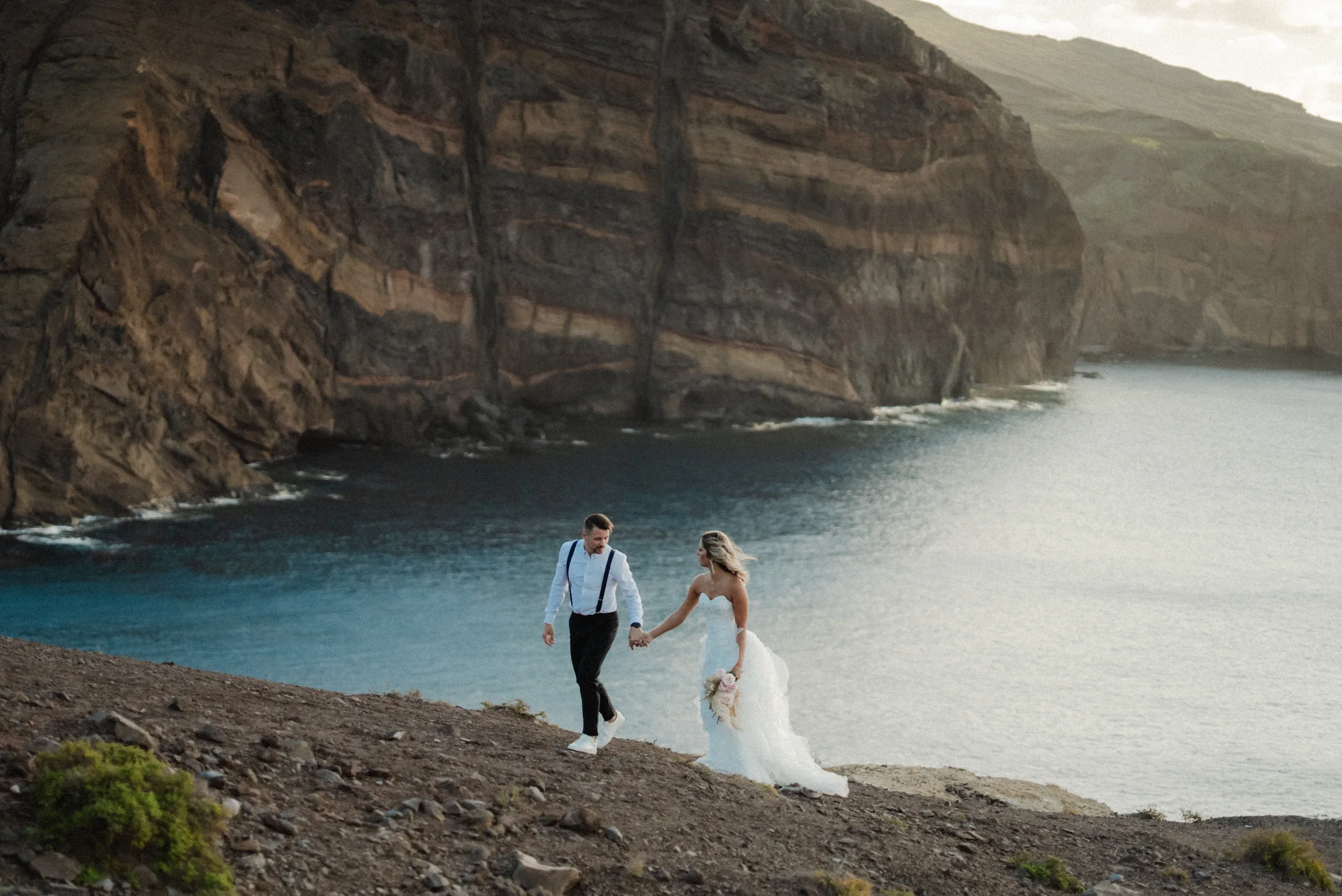 Couple on the dramatic Atlantic cliffs of Madeira