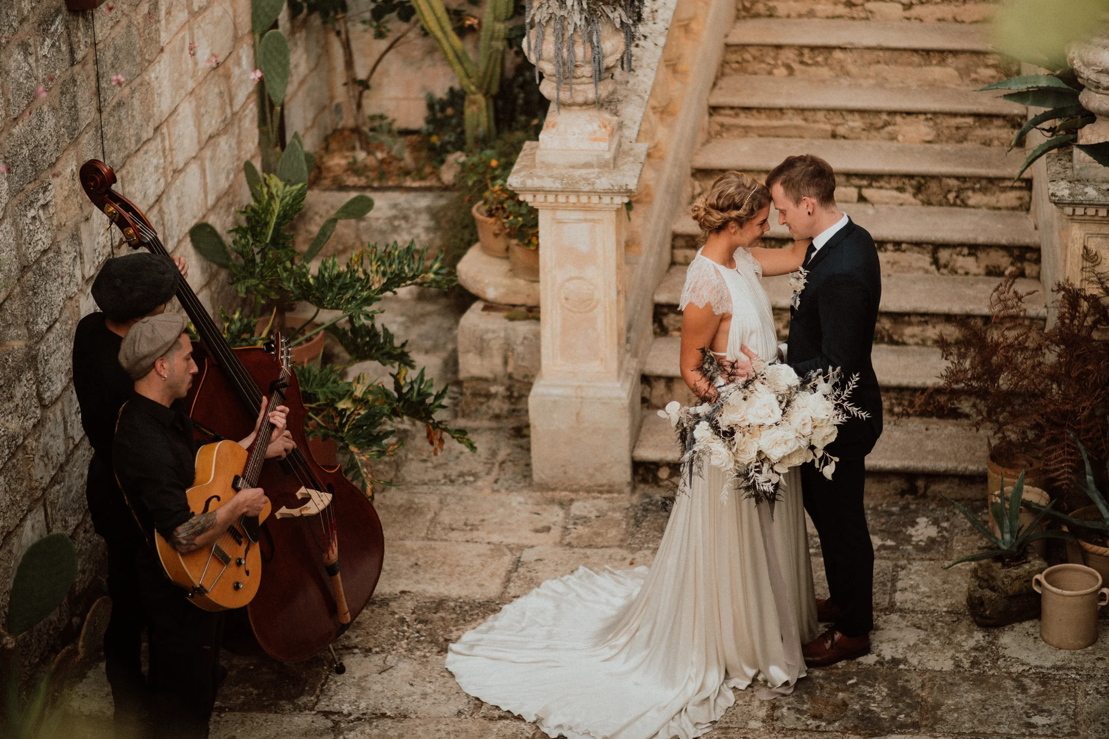 Editorial wedding ceremony on historic stone steps in Diso, Puglia