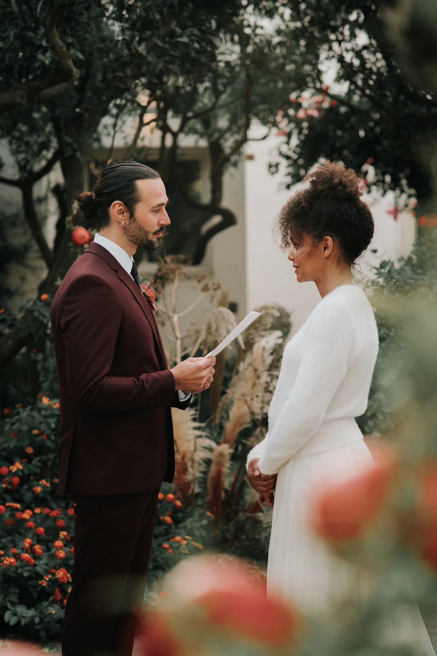 Editorial couple exchanging vows in a garden in Diso, Puglia